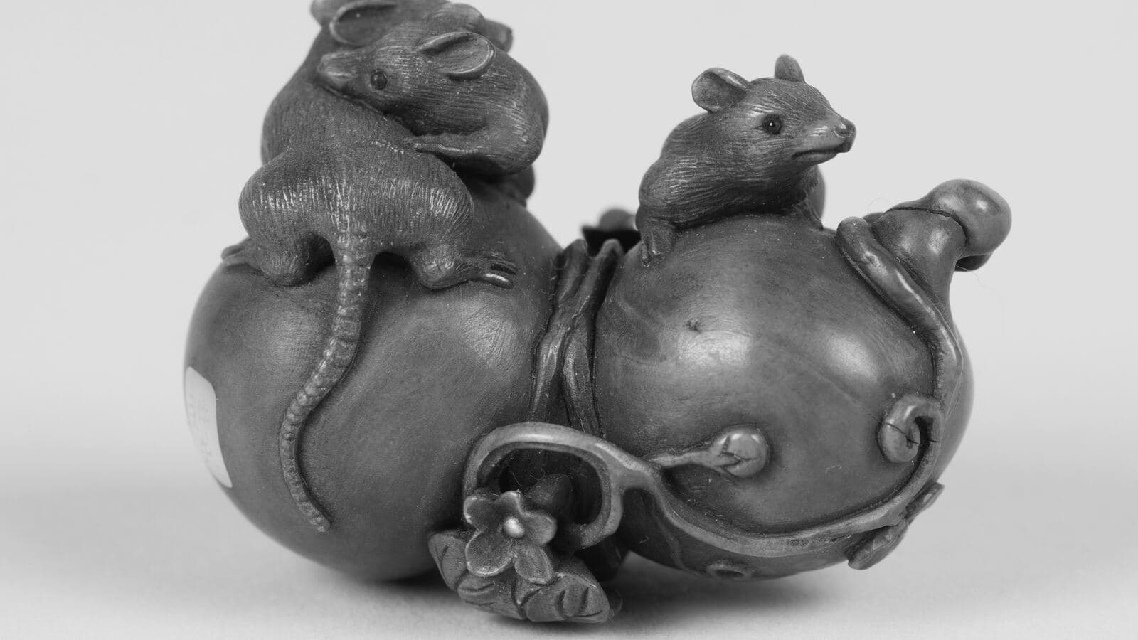 Mice climbing a gourd, a Japanese netsuke carved in wood